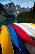Image of Canoes at Moraine Lake below Wenkchemna Peaks