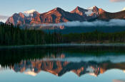 Image of Lake Louise Peaks reflected in Herbert Lake, sunrise