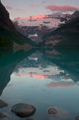 Image of Mount Victoria reflected in Lake Louise, sunrise