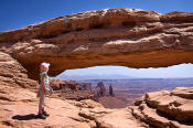 Image of Girl hiker and Mesa Arch, Canyonlands National Park, Utah, southwest